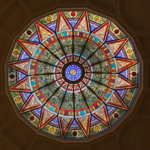 Stained glass rotunda on the ceiling of a library