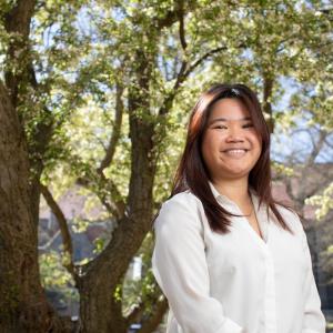 Isabelle Spirk portrait standing outside under a tree