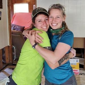 Katie Gregory ’15 and Ashley Kreitz ’15 pose for a photo in a house in South Carolina that was damaged by flood waters during Hurricane Helene