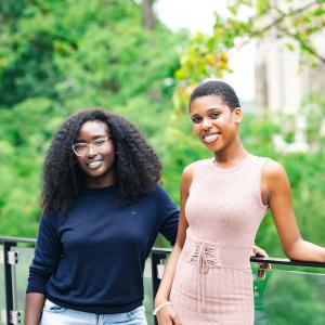 Lya Joseph ‘25 ‘26G and Emmanuella Agyemang ‘26 pose for a portrait smiling at the camera.