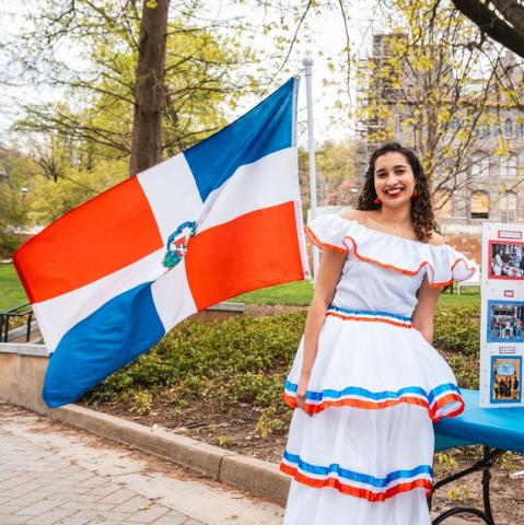 Estefania Ravelo Reyna '26 standing at an information table representing Lehigh's Dominican Culture Club