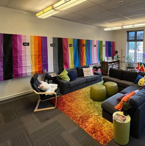 Inside the Lehigh Pride Center with LGBTQ flags on the wall