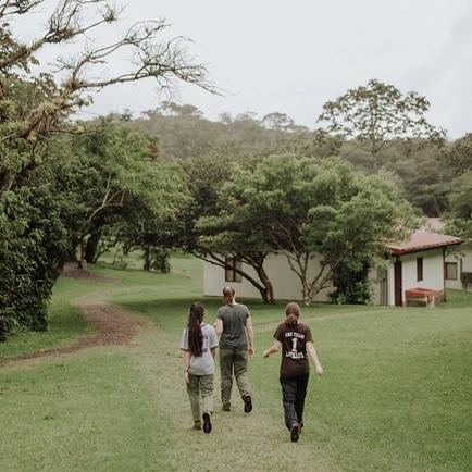 Sianin Spaur, Jessie Levy and Courtney Giardina walk back to camp in Costa Rica