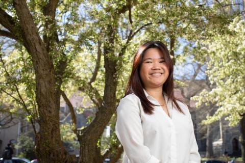 Isabelle Spirk portrait standing outside under a tree