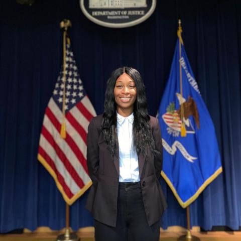 Raven Monique Gaddy portrait standing in the department of justice