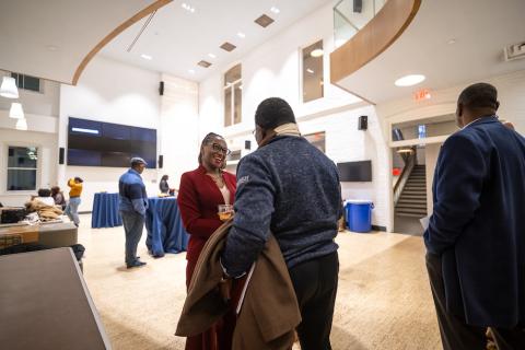 Simone A James Alexander laughs with a co-worker in Lehigh's global commons