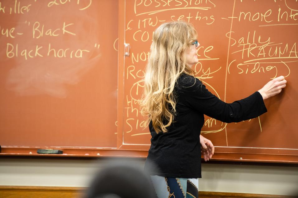 Dawn Keetley writes on a chalkboard