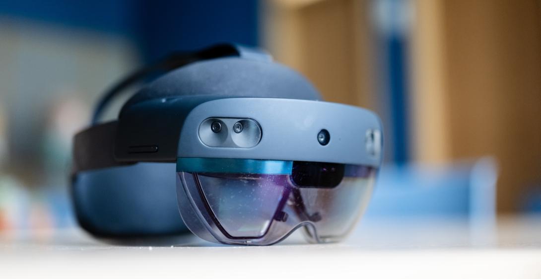 Virtual reality goggles and helmet sits on a table