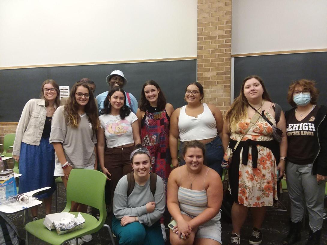 Women, Gender and Sexuality studies Students pose for a photo in a classroom.