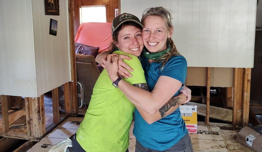 Katie Gregory ’15 and Ashley Kreitz ’15 pose for a photo in a house in South Carolina that was damaged by flood waters during Hurricane Helene